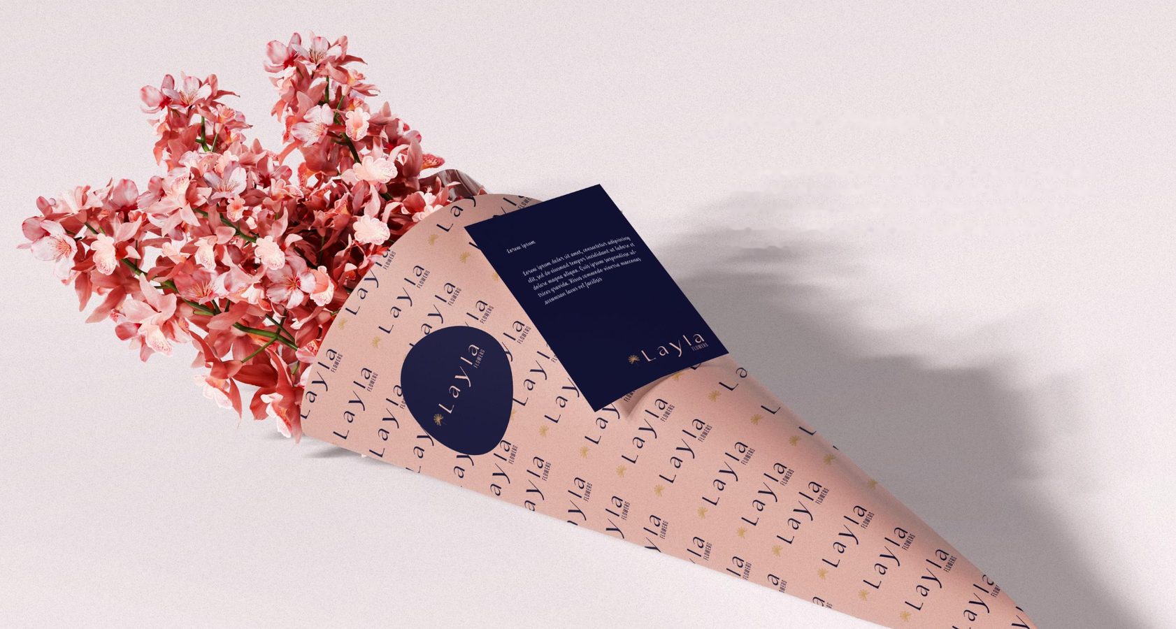 Bouquet in patterned Layla Flowers wrap with a navy message card