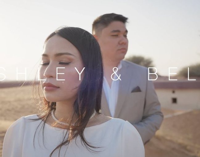 Wedding film still of a couple in the Dubai desert